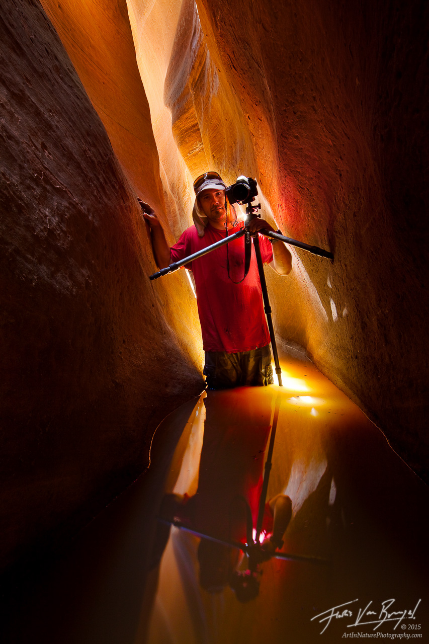 My friend poses during a short canyoneering trip in a narrow flooded slot canyon in Utah's Zion National Park.&nbsp;