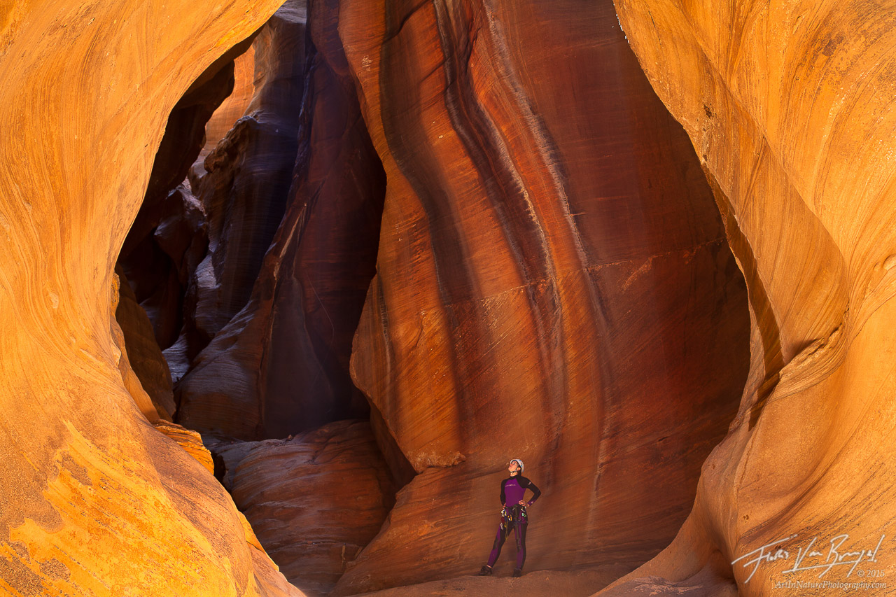 A canyoneer (my girlfriend, Aubrey), poses in a chamber of light in Zion National Park's Pine Creek Canyon.