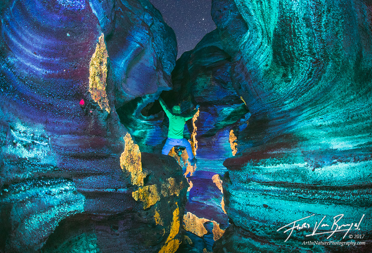 Calcium carbonate and other minerals come to life in this narrow volcanic canyon under shortwave ultraviolet light.