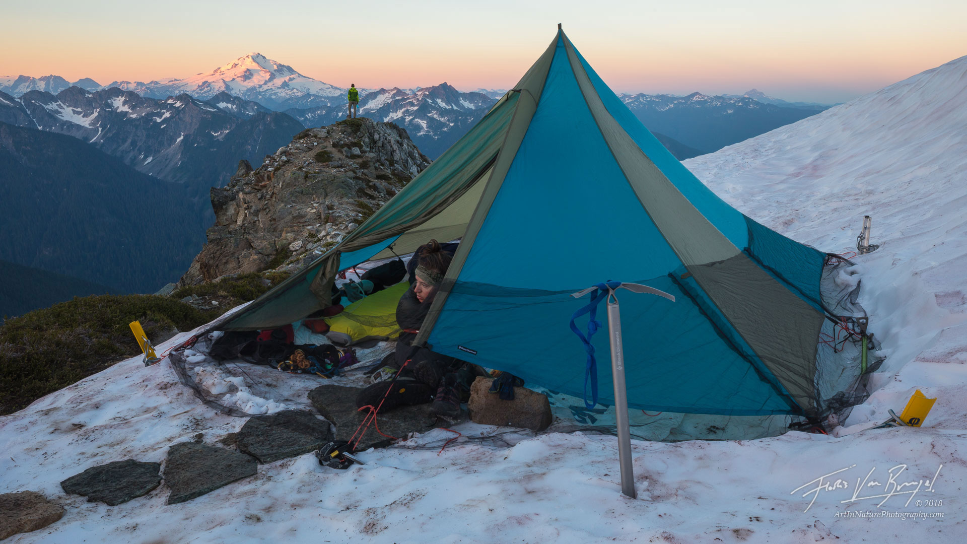 Sunrise on Itswoot Ridge, with a view of Glacier Peak. Aubrey takes in the view of the hanging glaciers on Dome Peak from her...