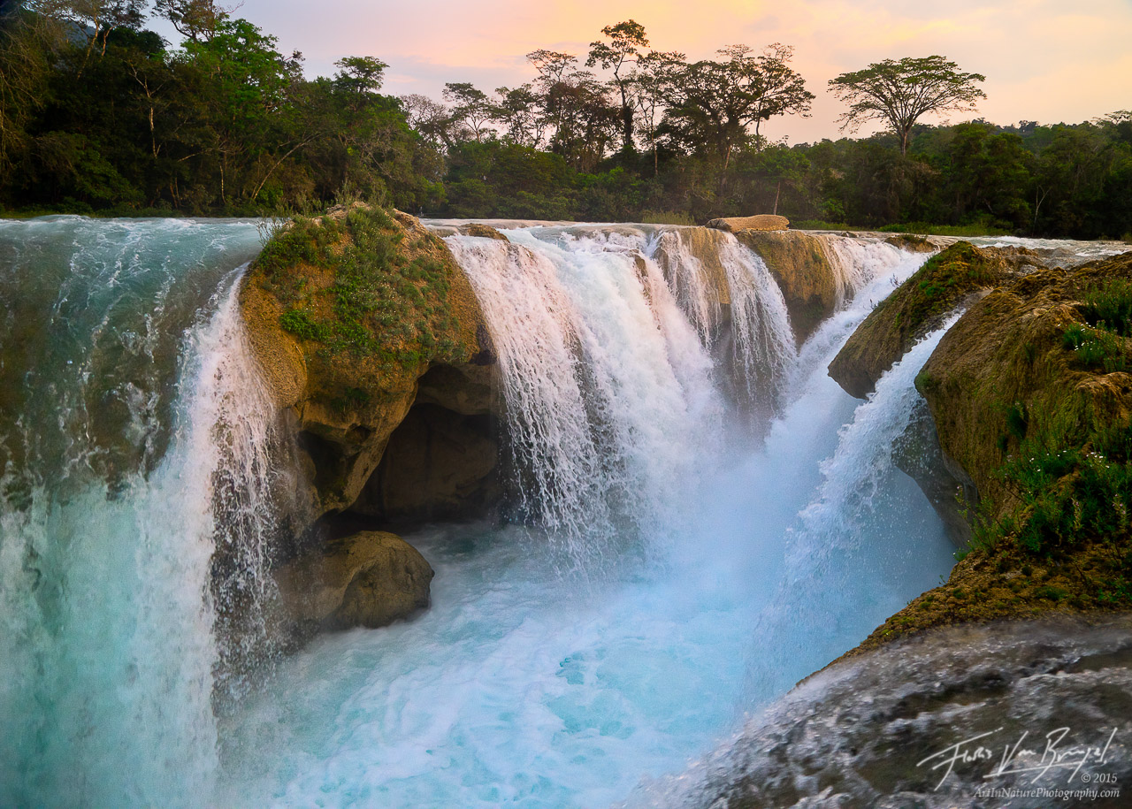 Sunset over the thundering waterfalls of Las Nubes on the Santo Domingo river. The blue in the water comes from the high mineral...