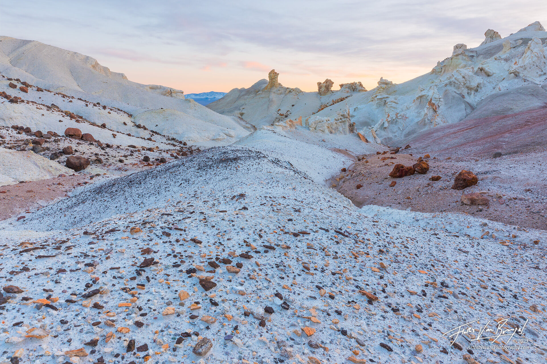 Soft sunset light illuminates the slowly eroding chalky white badlands in Nevada's Monte Cristo range.