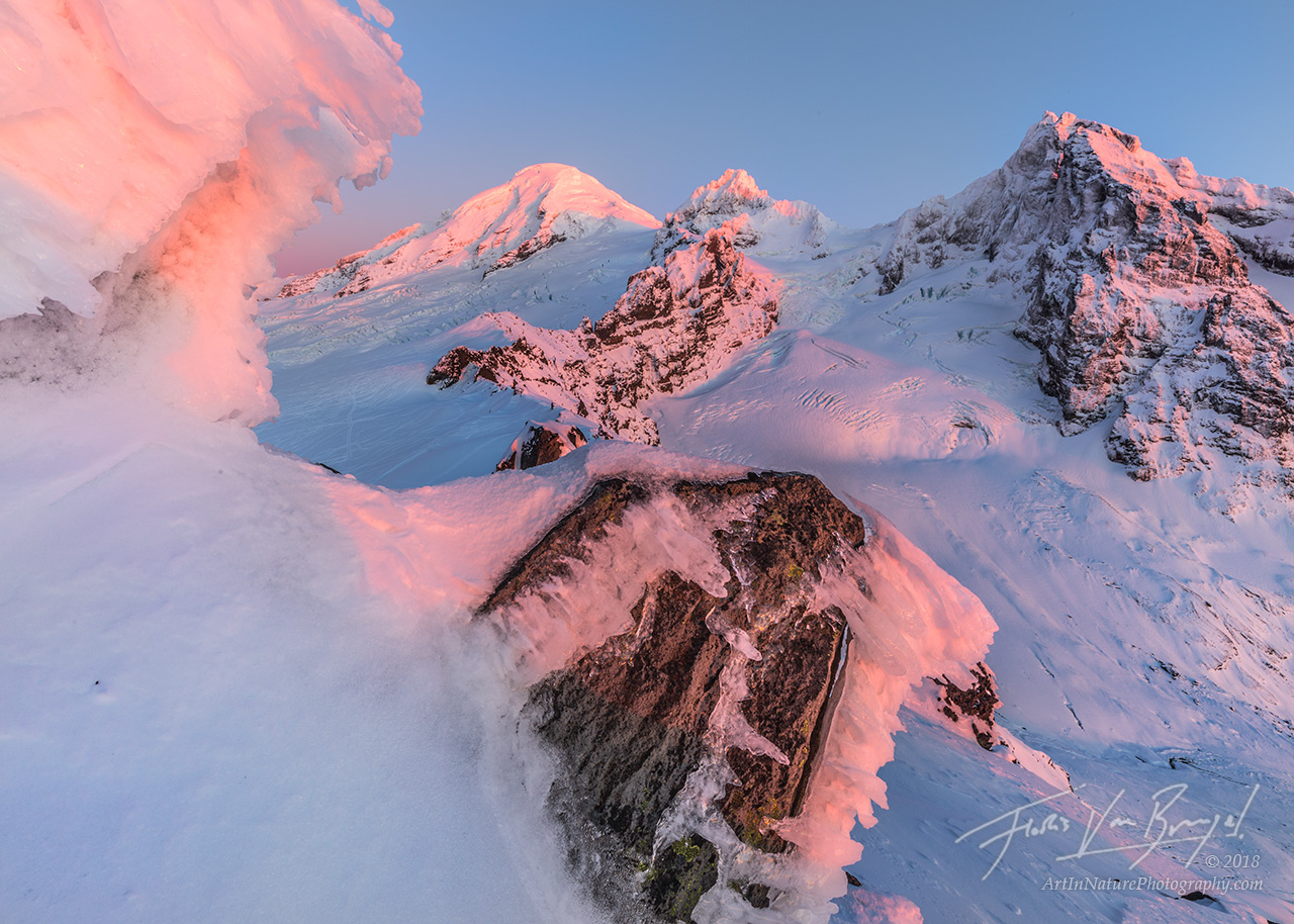 The last rays of sunshine light up this chilly winter view of Mt Baker, as seen from snowy Heliotrope Ridge, in Washington's...